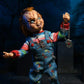 Chucky feliz con el collar damballa