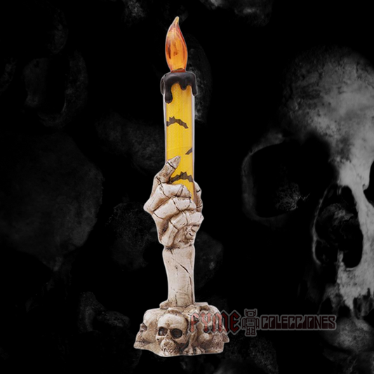 Vela led de mano de calavera